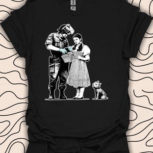 Banksy Dorothy Search T-Shirt – Wizard of Oz Parody Tee – Street Art Inspired Gift Unisex Men Women Shirt 1782PC