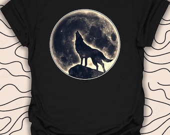 May include: Black t-shirt with a graphic of a wolf howling at the full moon.