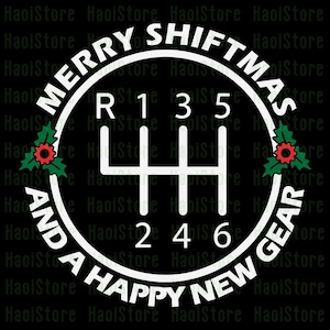 May include: White graphic on a black background. The design features a gear shift pattern with the text "MERRY SHIFTMAS AND A HAPPY NEW GEAR" in a circular arrangement. Holly and berries are included.