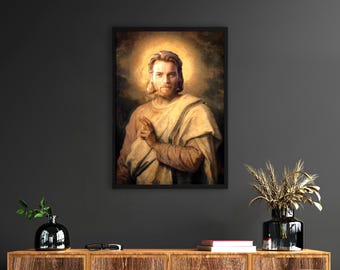May include: Framed portrait of a man with long hair and a beard, wearing a light-colored robe, with a golden halo. The artwork is displayed on a dark gray wall above a wooden cabinet. A black vase with wheat stalks is on the cabinet.
