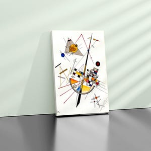 May include: Abstract art print featuring geometric shapes in black, white, red, yellow, and blue on a white background.