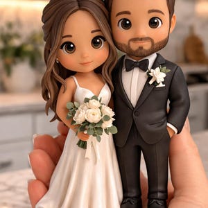 May include: A wedding cake topper featuring a bride and groom figurine. The bride wears a white dress and holds a bouquet of white flowers. The groom is in a black tuxedo with a bow tie. The figurines have detailed facial features and brown hair.