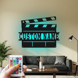 Arte de parede de metal com LED em claquete personalizada: decoração de filme personalizada