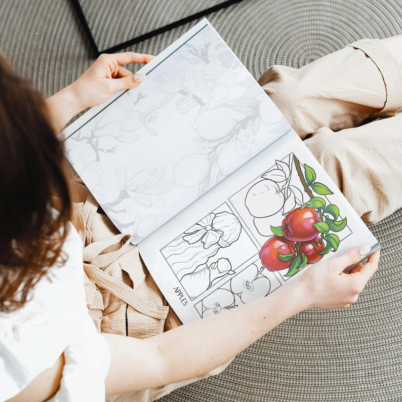 Woman coloring in apples