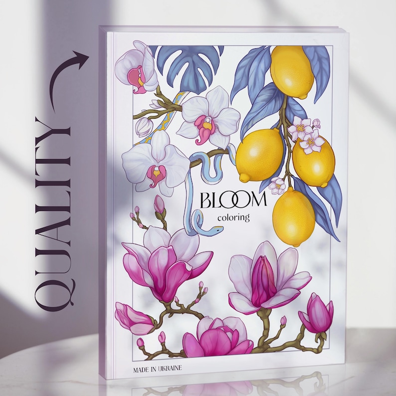 May include: A coloring book titled "Bloom Coloring" features illustrations of white orchids, pink magnolias, and yellow lemons. A light blue snake winds through the floral arrangement. The cover is white with the text "Bloom coloring" and "Made in Ukraine".