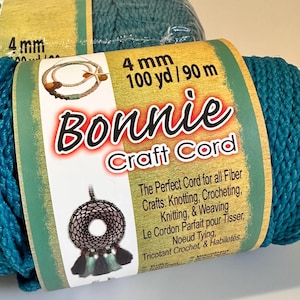 May include: Teal blue 4 mm craft cord, 100 yards / 90 metres, Bonnie Craft Cord label with instructions for knotting, crocheting, knitting, and weaving.