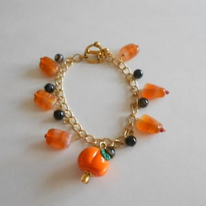 Orange Bracelet Orange Glass Beads Black Onyx Beads Charm Bracelet Black Bracelet Halloween Bracelet Orange Pumpkin Charm Chain Bracelet