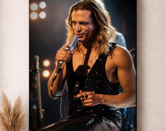 May include: A framed wall art print featuring a long-haired performer wearing a black sequined tank top and dark trousers, holding a silver microphone while singing on a stage with blurred stage lights and musical instruments in the background.