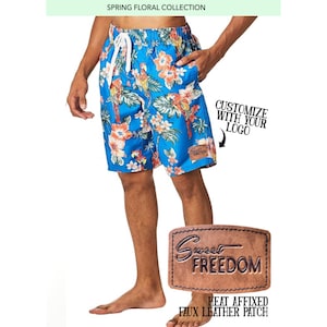 May include: Blue floral print swim trunks with a brown leather patch that says "Sweet Freedom". The patch is heat-affixed. The text "Customize with your logo" is also visible in the image.