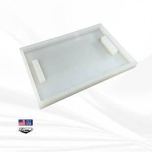 May include: White rectangular silicone mold with two rectangular cutouts. The mold is made in the USA by Zapped Design.