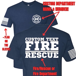 May include: A navy blue t-shirt with a white "FIRE RESCUE" graphic on the back. The shirt has a white American flag on the sleeve and a white firefighter logo on the front. The text "CUSTOM DEPARTMENT NAME & NUMBER!" is above the logo. The text "CUSTOM TEXT" is above the "FIRE RESCUE" graphic. The text "Fire/Rescue or Fire Department" is below the graphic.