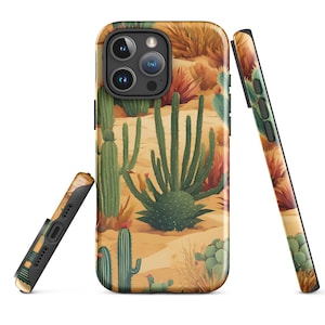 May include: A phone case with a desert landscape design featuring cacti and sand in shades of brown, green, and yellow.