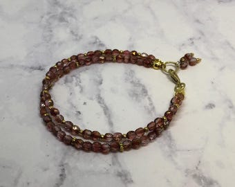 Handmade Purple Fire Polished Glass Beaded Bracelet with Gold Accents