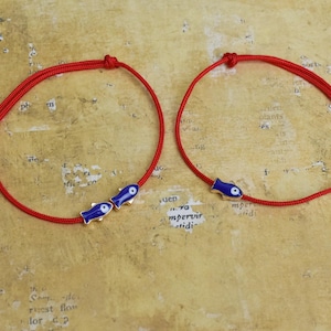 May include: A set of three ceramic mugs with a speckled, matte finish. The mugs are in shades of cream, light gray, and dark gray. Each mug has a simple, minimalist design, perfect for coffee or tea.