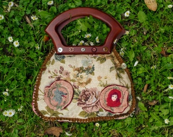 storybook fairytale tapestry tote bag, has vintage wooden handles, featuring little red ridinghood & wolf embroidered cameos