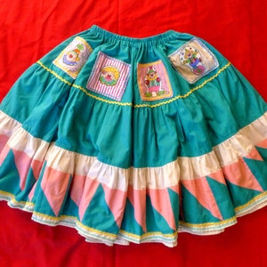 womens full circle gathered elastic waist skirt has vintage clown patches & traditional patchwork border