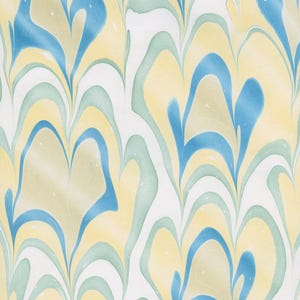 May include: Abstract pattern with a marbled effect. The design features flowing, organic shapes in shades of blue, yellow, and green against a white background. The pattern has a watercolor-like appearance, with soft transitions between colors.