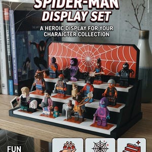 May include: A black tiered display stand featuring an orange spiderweb backdrop, designed for small character figurines. The stand includes text reading PREMIUM SPIDER-MAN DISPLAY SET and A HEROIC DISPLAY FOR YOUR CHARAICTER COLLECTION.