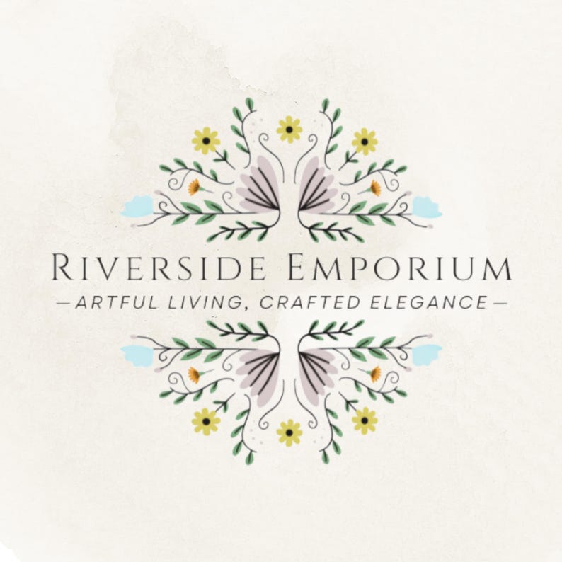 May include: A logo for Riverside Emporium featuring the text "RIVERSIDE EMPORIUM" and "ARTFUL LIVING, CRAFTED ELEGANCE" centered between two symmetrical floral illustrations with yellow, light blue, and purple petals on green stems.