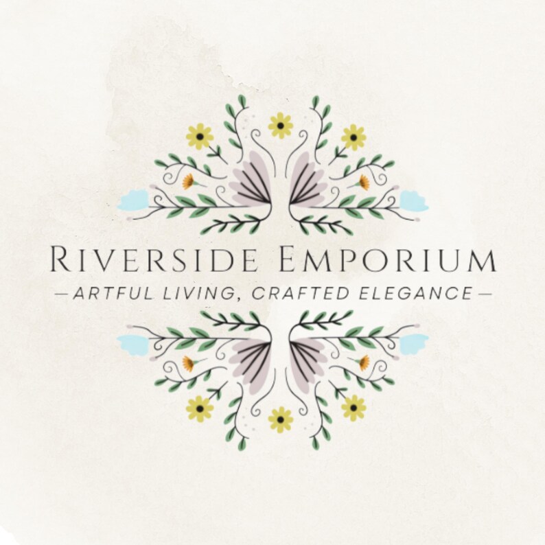 May include: A logo for Riverside Emporium featuring the text "RIVERSIDE EMPORIUM" and "ARTFUL LIVING, CRAFTED ELEGANCE" centered between two symmetrical floral illustrations with yellow, light blue, and purple petals on green stems.