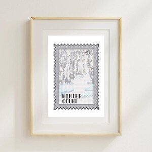 May include: A framed print featuring a cross-stitch design resembling a postage stamp. The artwork depicts a winter landscape with a snowy forest and a body of water. The text "WINTER COURT" is displayed below the image.