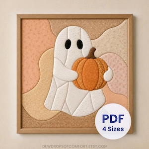 May include: A square framed wall art piece featuring a fabric-style ghost holding an orange pumpkin. The ghost is white with black oval eyes, set against a background of wavy, textured beige and peach fabric shapes. Includes a white circular badge with the text PDF 4 Sizes and the website text DEWDROPSOFCOMFORT.ETSY.COM at the bottom.