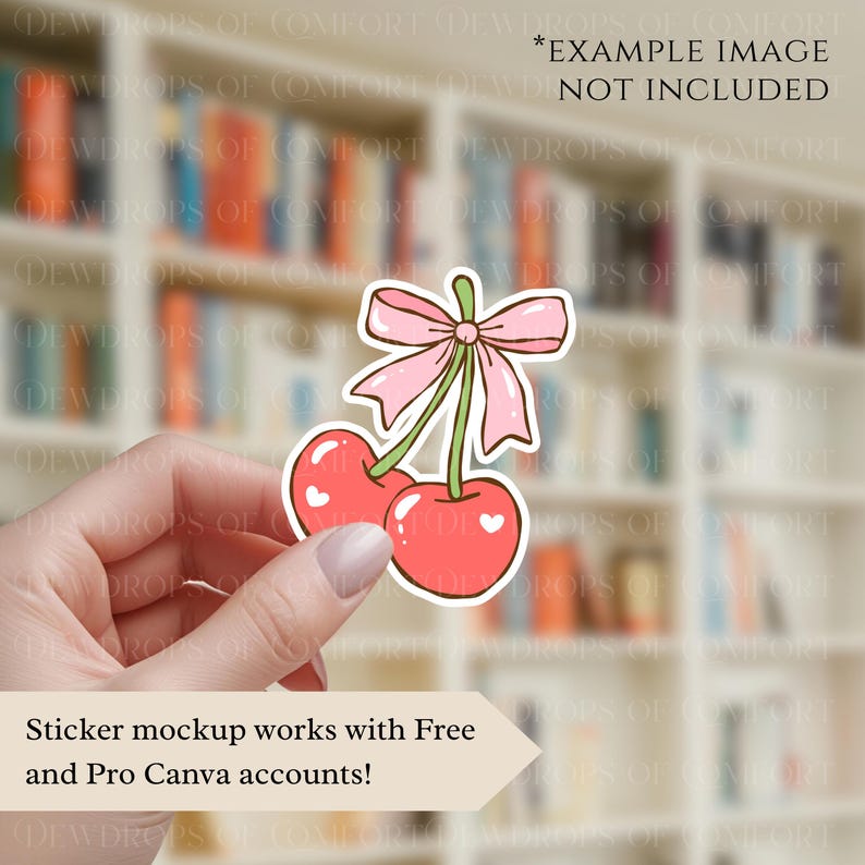 May include: A sticker featuring two red cherries with white heart details, connected by a green stem and a pink bow. The sticker is held in a hand. Text on the image reads: Sticker mockup works with Free and Pro Canva accounts!