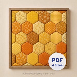 May include: A square wall art piece featuring a mosaic of fabric hexagons in various shades of yellow and orange, including floral, gingham, and polka dot patterns, enclosed in a light wood frame with a white circular label reading PDF 4 Sizes.