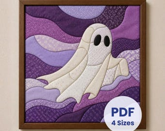 May include: A framed fabric wall art piece featuring a white ghost with black oval eyes centred against a background of layered, wavy purple fabric strips. A circular white overlay in the corner displays the text PDF 4 Sizes.