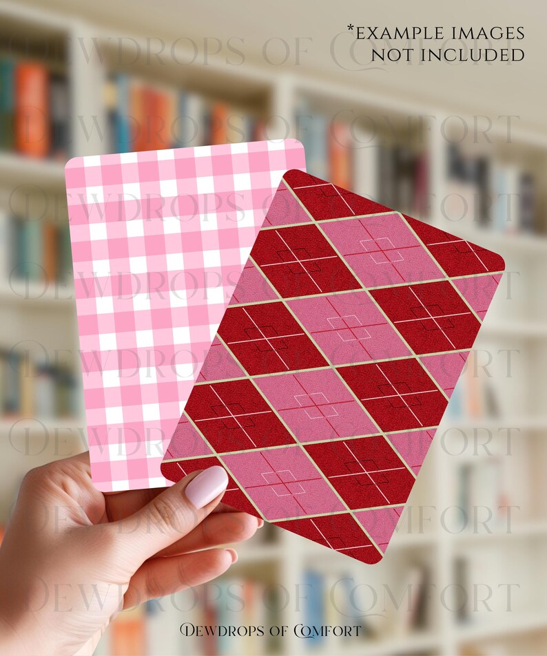 May include: Two decorative cards with different patterns. One card features a pink and white gingham pattern, while the other showcases a red and pink argyle design. The cards are held in front of a blurred background of a bookshelf.