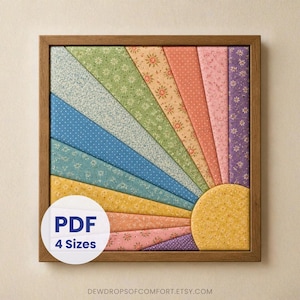 Puede incluir: Un cuadro cuadrado en marco de madera con un diseño de rayos de sol hecho de tiras de tela con varios estampados florales y de lunares en tonos amarillo, naranja, rosa, morado, azul y verde. Una etiqueta circular blanca dice PDF 4 Sizes.