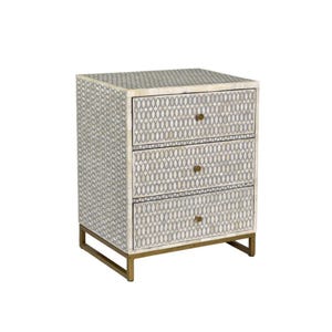 May include: A three-drawer nightstand with a geometric pattern in shades of gray and cream. The drawers have brass-colored knobs and the base is a matching brass color. The nightstand is a stylish piece of bedroom furniture.