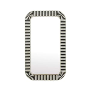 May include: A rectangular mirror with rounded edges, featuring a black and white striped design. The mirror has a simple, modern style.