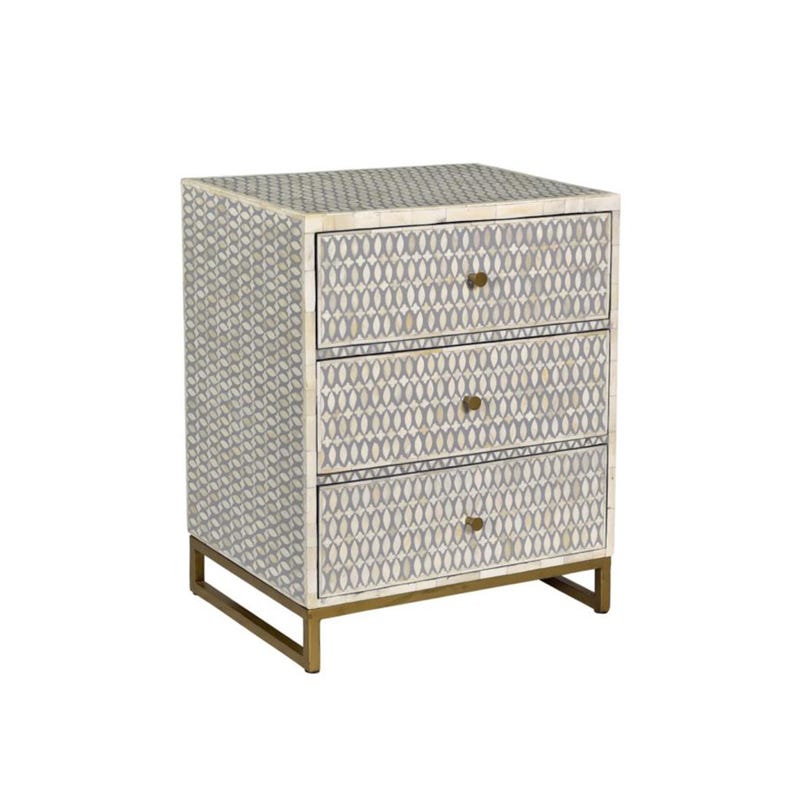 May include: A three-drawer nightstand with a geometric pattern in shades of gray and cream. The drawers have brass-colored knobs and the base is a matching brass color. The nightstand is a stylish piece of bedroom furniture.