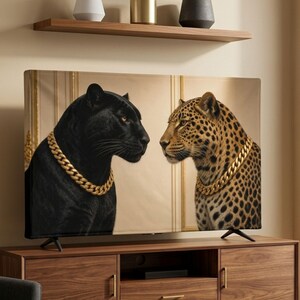 May include: A television screen displaying an image of a black panther and a spotted leopard facing each other, both wearing thick gold chain necklaces. The screen is positioned on a wooden media console with a shelf above holding three vases.