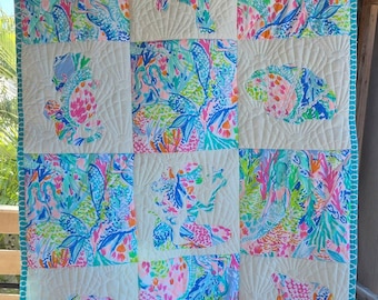 Made to order baby size ocean quilt made with authentic fabric.