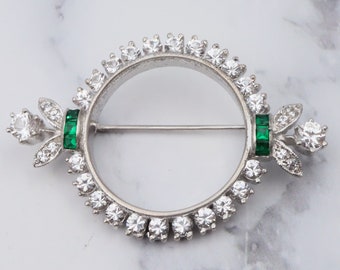 Antique Art Deco rhodium plated sterling, quartz & synthetic emerald circle frame brooch