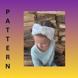 May include: A white crocheted headband with pastel-colored accents is worn by a person. The headband is made of a soft, textured yarn. The background features a stack of wooden logs, with a gradient background of purple and yellow.
