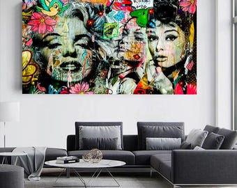 May include: A colorful collage of three famous women's faces, including Marilyn Monroe, Audrey Hepburn, and another woman. The collage is made up of various textures and patterns, including flowers, graffiti, and paint splatters.