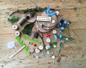 Eco friend,y diy fairy garden with blue arch and sign post