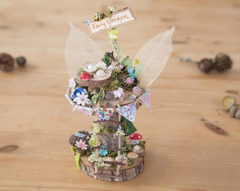Diy fairy tree house with table , step ladder and  tiny liberty print bunting