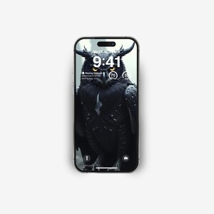 May include: A black and white phone screen displaying a black owl with yellow eyes. The time is 9:41. The phone screen also shows the text "Waxing Gibbous" and "Mauritius 6:22 PM".
