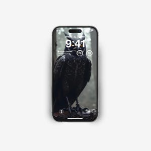 May include: A smartphone displaying a dark image of an owl with the time 9:41 on the screen. The phone's screen also shows the date, Wed 7, and the time 7:28 PM.