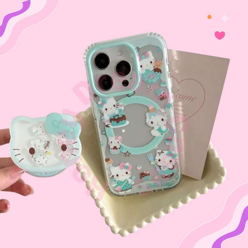 May include: Clear phone case with a mint green border and Hello Kitty illustrations. The case features Hello Kitty characters with cakes and cupcakes. A matching Hello Kitty phone grip is also visible.