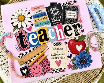 May include: A pink t-shirt with a colorful graphic design for teachers. The design includes the word "teacher" in large letters, a daisy, an apple, and the text "You got this!" and "Making a difference every day."
