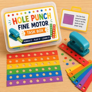 May include: A clear plastic task box labeled HOLE PUNCH FINE MOTOR TASK BOX with a teal hole punch, a set of colorful paper strips with pre-printed dots, and an instruction card. The kit includes various paper strips in red, orange, yellow, green, blue, and purple.