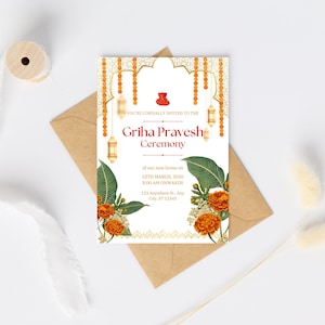 May include: A white invitation card with gold and orange accents. The text reads "You're cordially invited to the Griha Pravesh Ceremony of our new home on 23th March, 2030 8:00 AM onwards 123 Anywhere St. Any City, ST 12345".