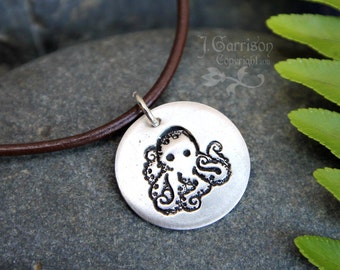 Charming octopus necklace - handmade fine silver circular charm on brown leather cord - recycled silver