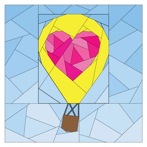 May include: A yellow hot air balloon with a pink heart-shaped design. The balloon is made of many small pieces of fabric, creating a patchwork effect. The balloon is floating in a blue sky.