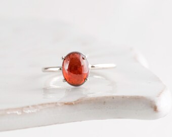 Dainty Garnet women's ring US size 6 1/2 in sterling silver prong/claw setting oval cabochon
